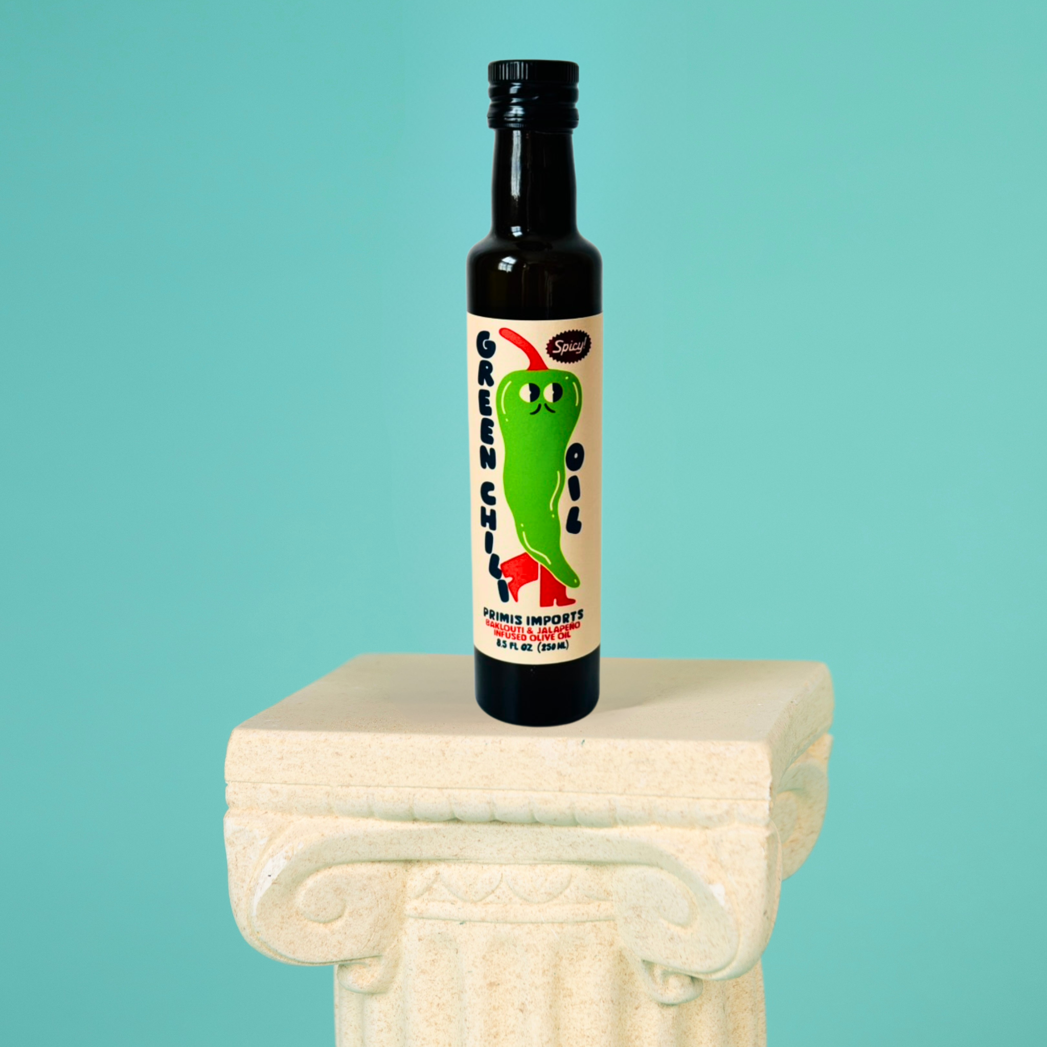 Bottle of sauce with a colorful label featuring a green pepper on a white pedestal against a teal background