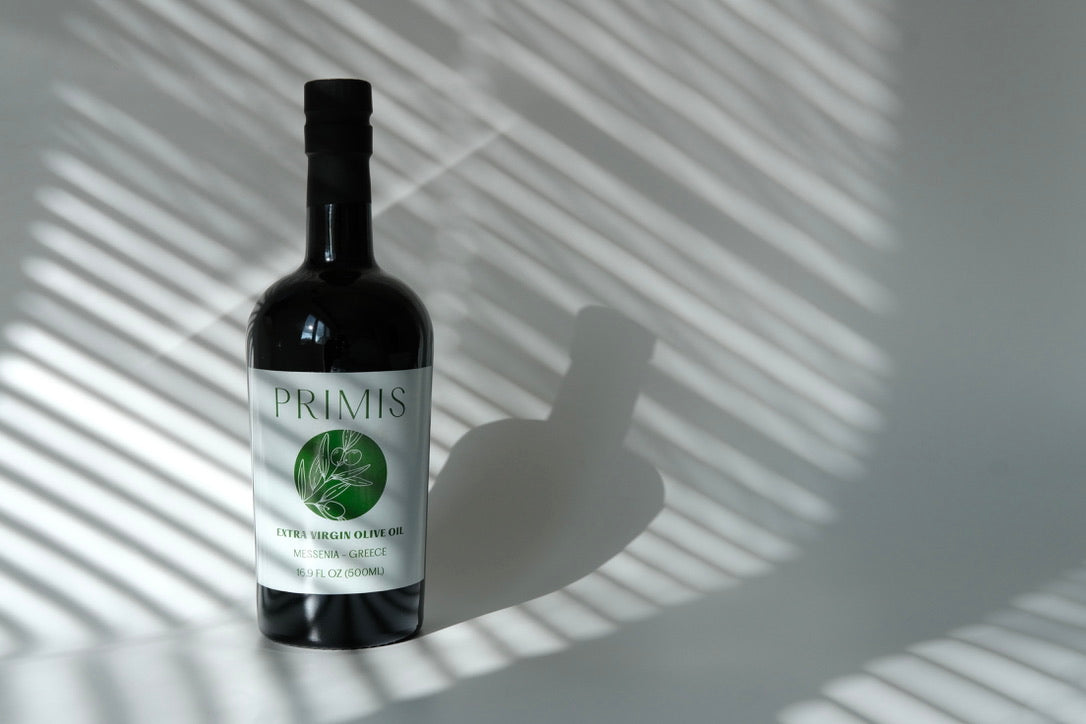 Primis EVOO on a white canvas with shadows